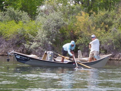 two men fishing on boat